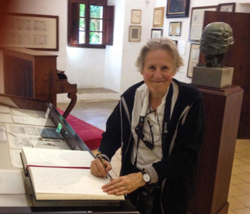 Annik signing the guest book in the Celda de Frédéric Chopin y George Sand